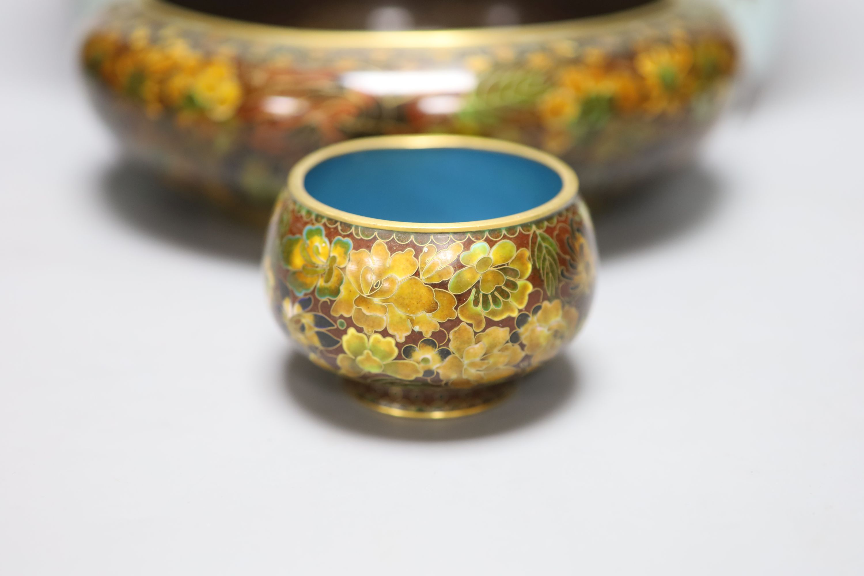 A pair of Japanese turquoise ground cloisonne enamel vases, a large cloisonne bowl and smaller matching bowl, tallest 31cm